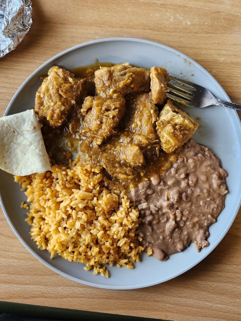 Close-up of carne asada, tamales, and tortas.