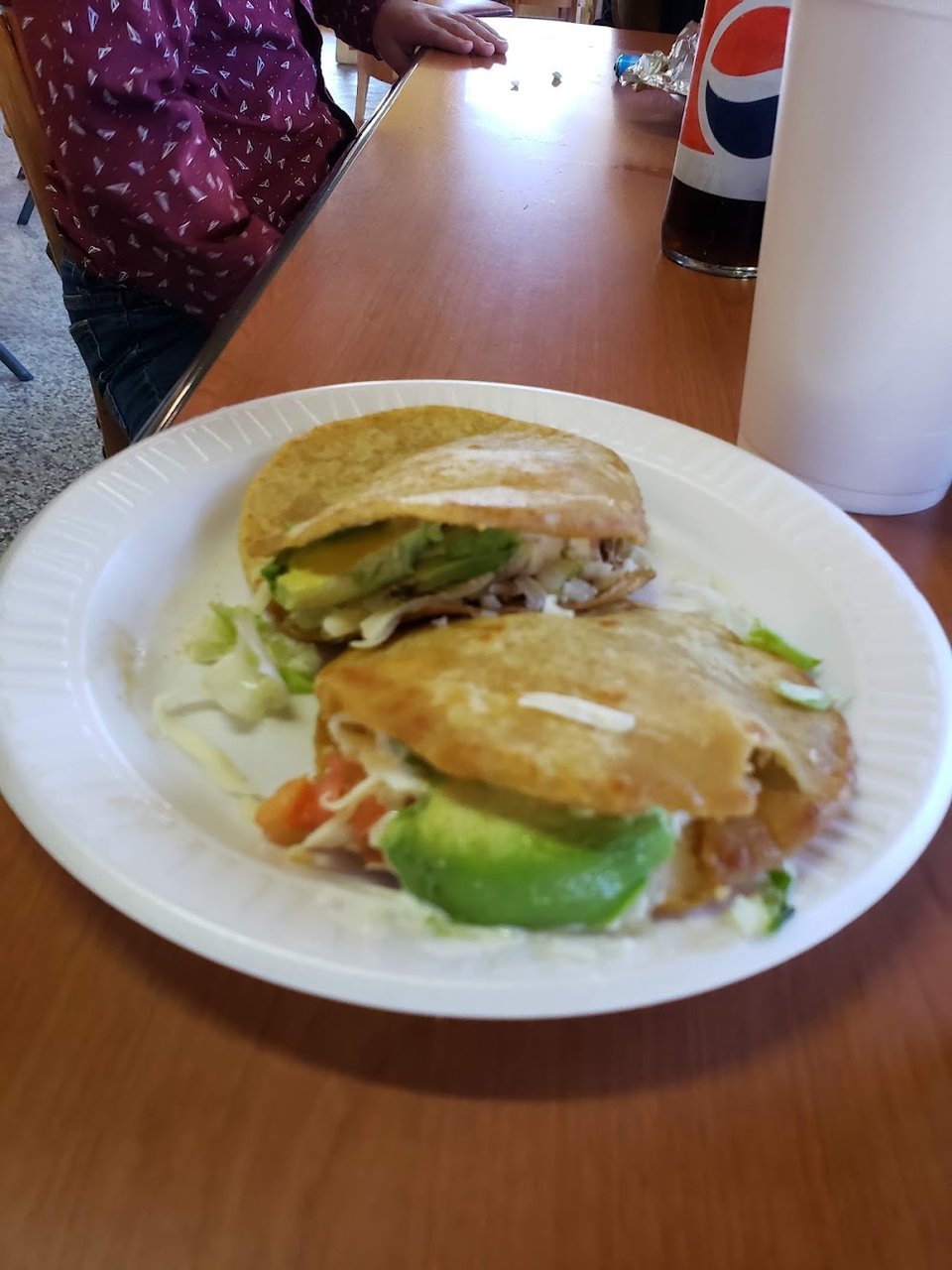 Close-up of carne asada, tamales, and tortas.