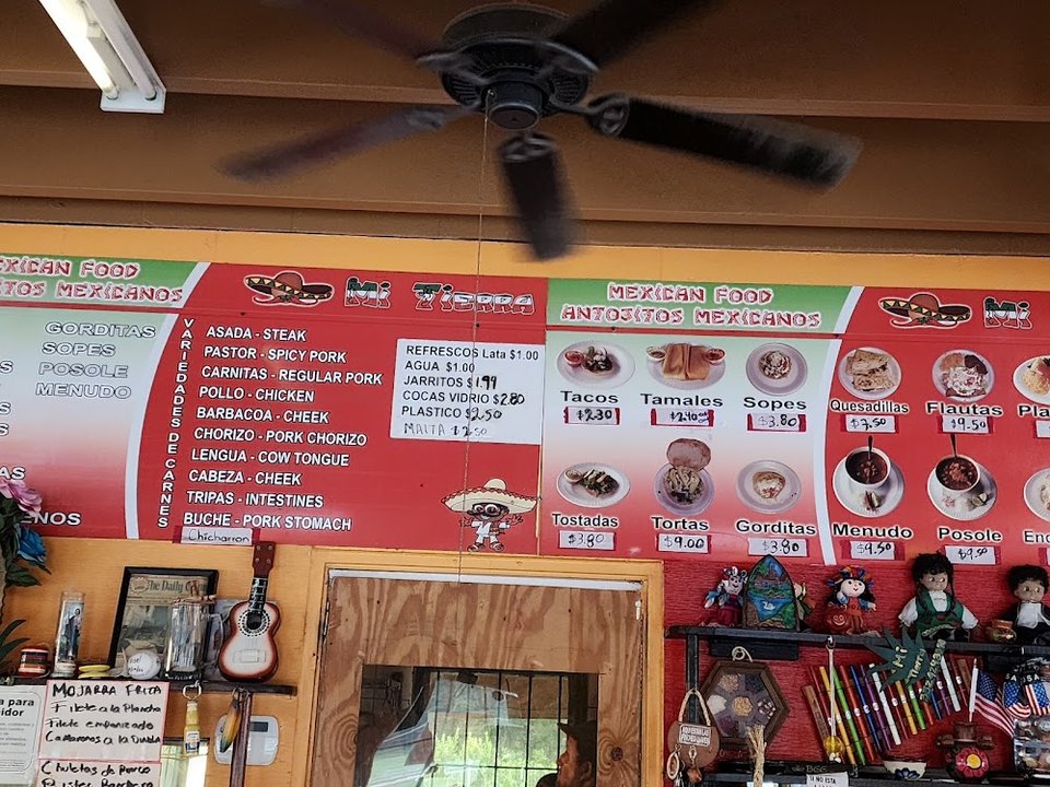 Assorted Mexican entrees served on colorful plates.
