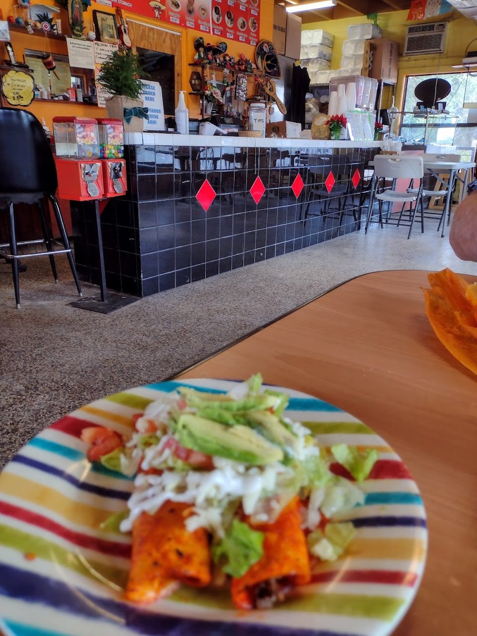 Mexican dishes arranged on plates for a restaurant menu.